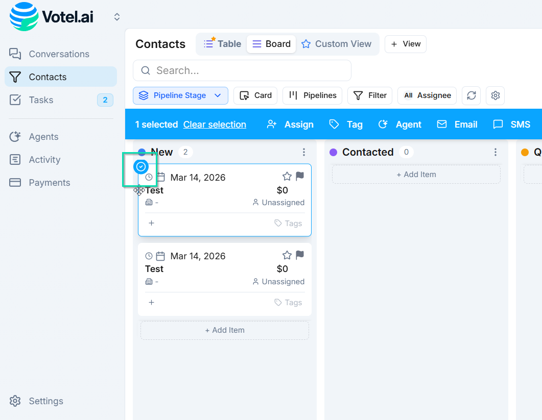 Click and hold on a contact card.